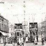 Old photo of trams in Burnley town centre Lancashire England UK