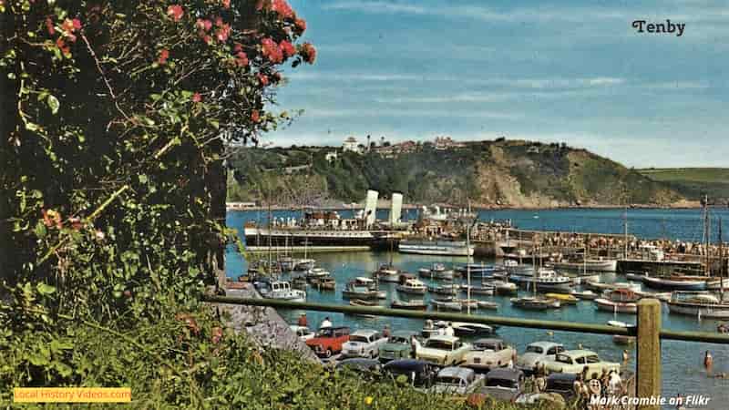 Old postcard of a steamer, boats and cars at Tenby, Pembrokeshire