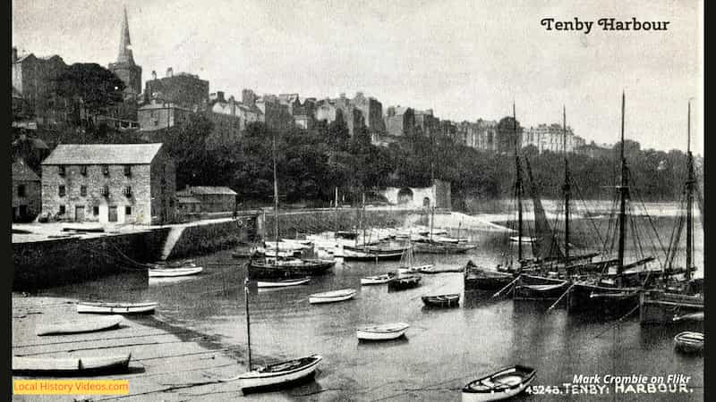 Old black and white postcard of fishing boats at Tenby's Harbour, Wales