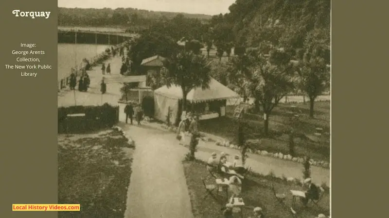 Old cigarette card photo of people enjoying walks and refreshments at Torquay