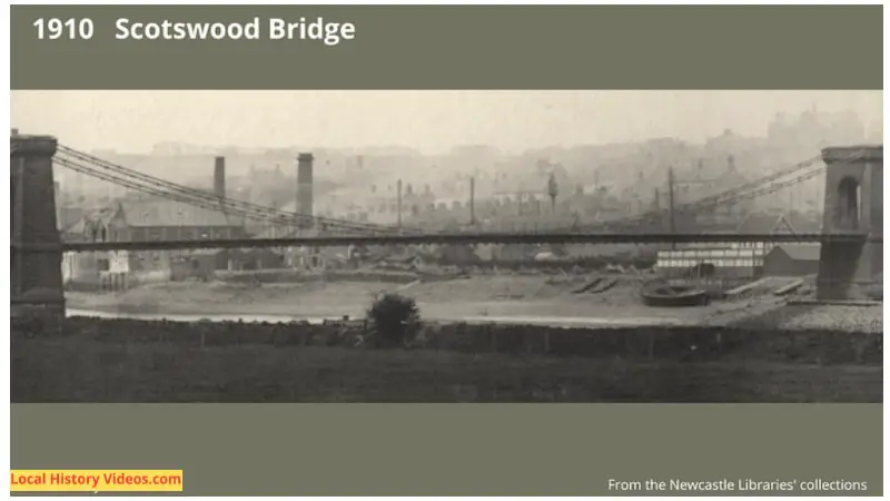 Closeup of a 1910 photo of the old Scotswood Bridge, known locally as the Chain Bridge, showing boats at the the side of the River Tyne, and many chimneys in the air
