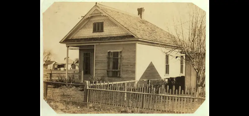 Old photo of the Rommel family home at 430 N. Loomis St, Fort Collins, Colorado, which was boarded up for six months this year while family lived in a little shack, 1915