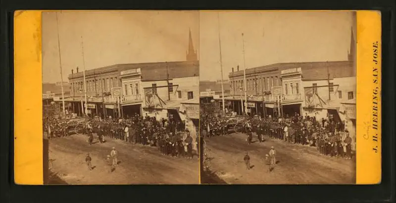 Old stereograph from the early 1870s of people assembled for a parade at San Jose California