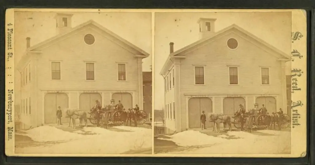 Old stereograph image of the Fire House and steam powered horse drawn fire engine in Newburyport, Massachusetts