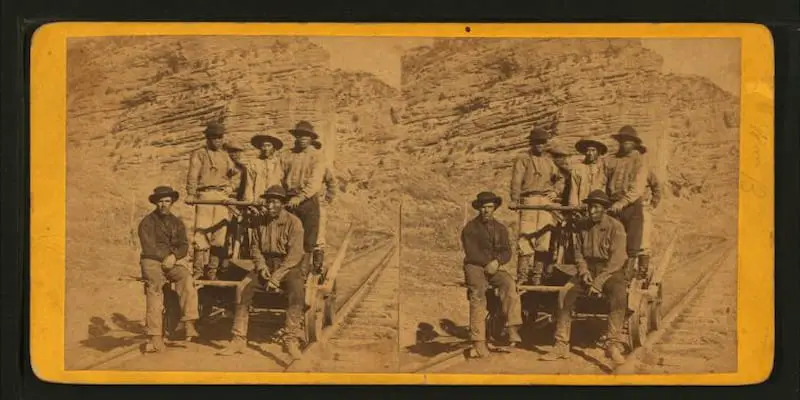 Old stereograph of John Chinaman working on the railroad, taken in 1875