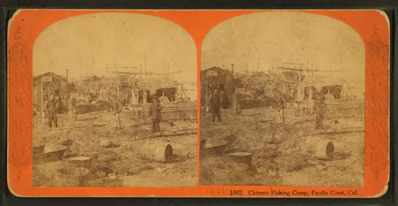 Old stereograph of a Chinese fishing camp in California, circa 1870s