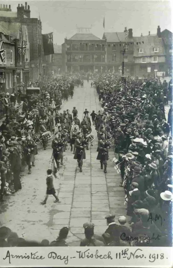 Old photo postcard of Armistice Day at Wisbech, Cambridgeshire, on 11 November 1918, showing the London Scottish Military Band