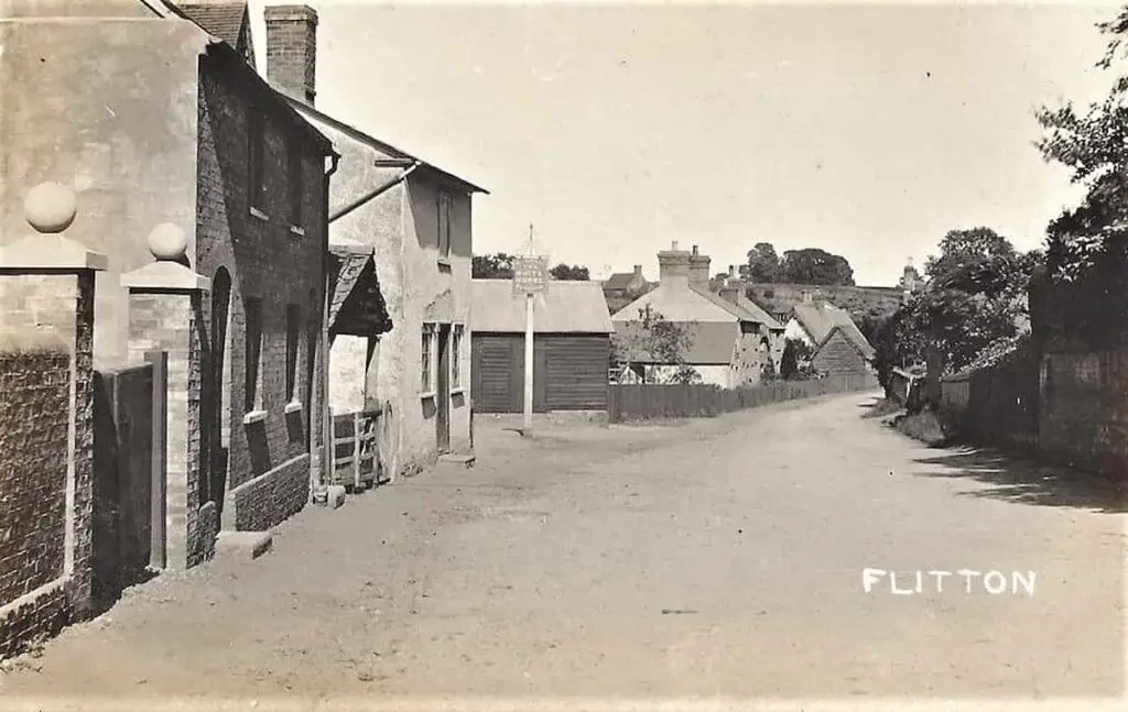 Old photo postcard of Flitton in Bedfordshire, England, showing the White Horse pub in its setting