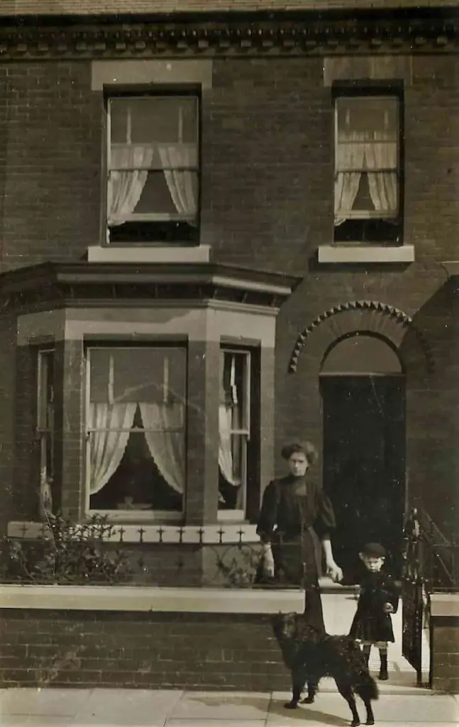 Old photo postcard of little Arthur and the dog Juno at 147 Turncroft Lane in Stockport, circa 1912