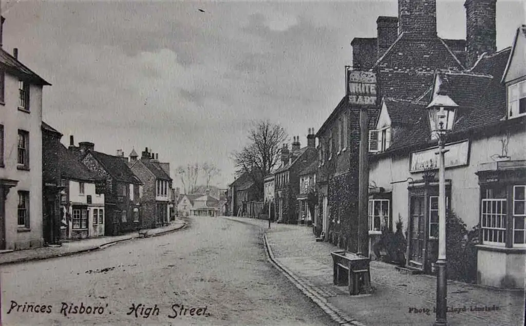 Old photo postcard of the High Street at Princes Risborough in Buckinghamshire, including the White Hart pub, circa 1905