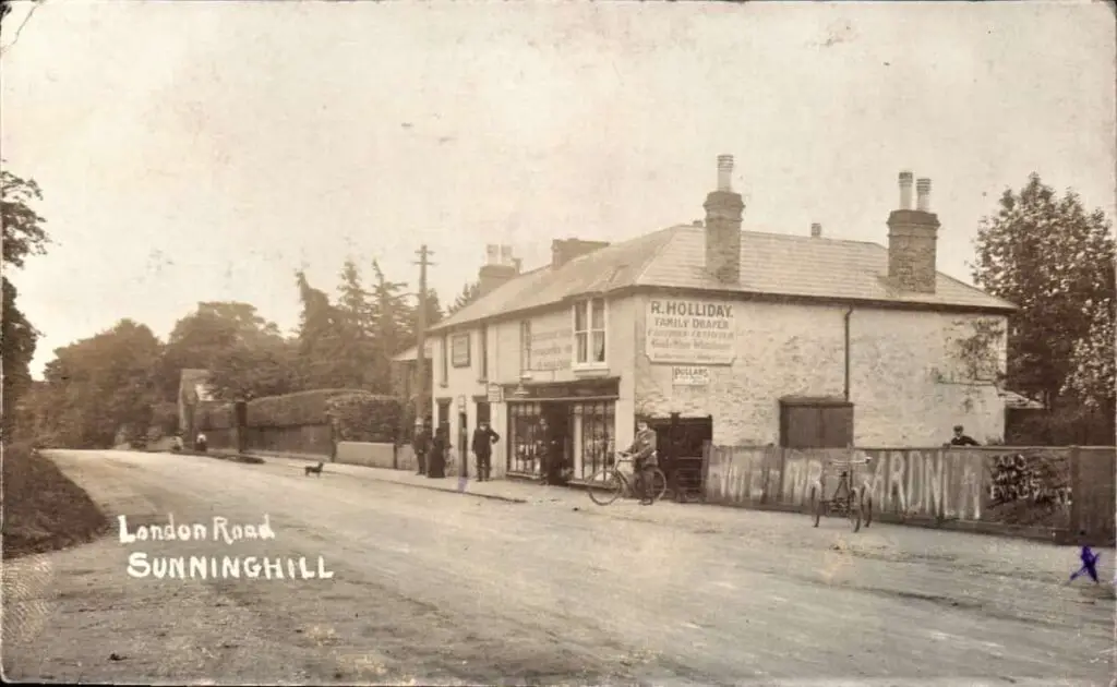 Old photo postcard of the R Holliday Family Draper's shop on London Road in Sunninghill, Berkshire, in 1914
