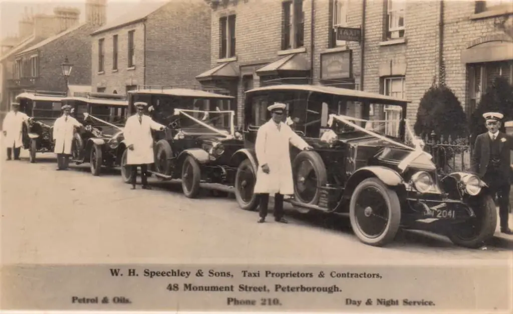 Vintage postcard of WH Speechley & Sons Taxi Proprietors & contractors at 48 Monument Street in Peterborough, Cambridgeshire, in 1920