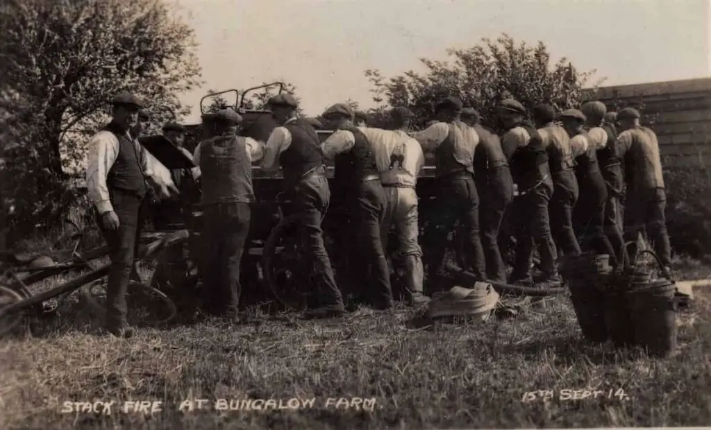 Vintage postcard of men at a stack fire at Growcock's Farm in Newborough, Cambridgeshire, on 15th September 1914