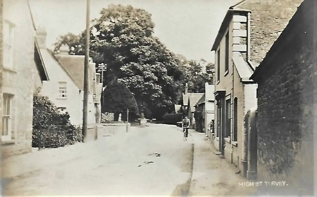 Vintage postcard of the High Street in Turvey, Bedfordshire