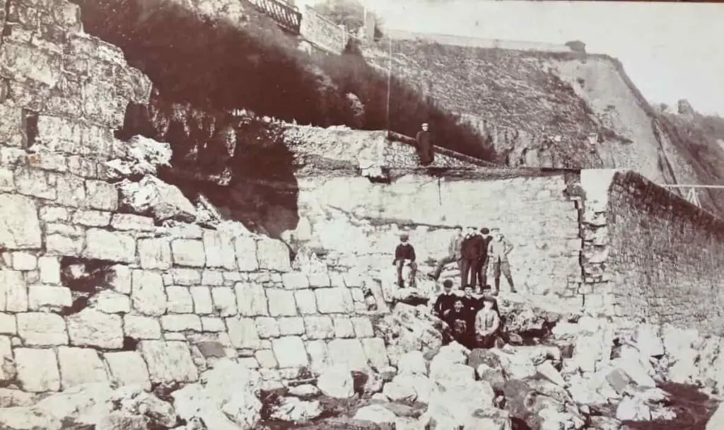 Vintage postcard of the sea wall damage at Teignmouth in Devon, circa 1908