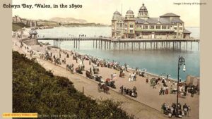 Old photo of the beach and pier at Colwyn Bay, Wales, in the 1890s