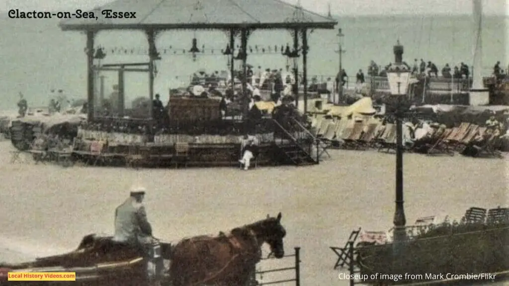 Closeup of an old photo postcard of a carriage and deckchairs at the seafront, Clacton-on-Sea, Essex