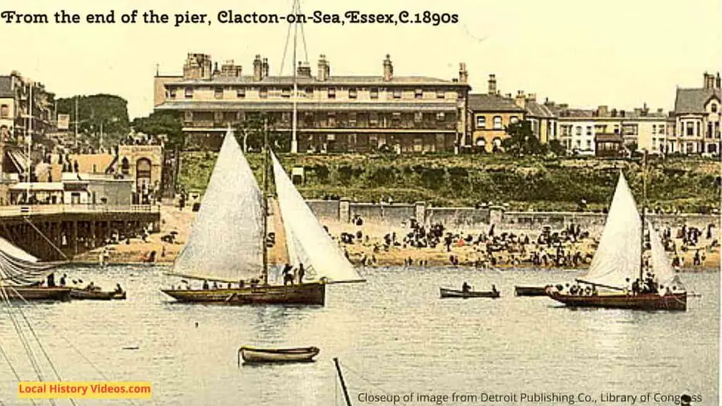 Closeup of people sailing in an old photo of boats at the end of the pier at Clacton-on-Sea, Essex, in the 1890s