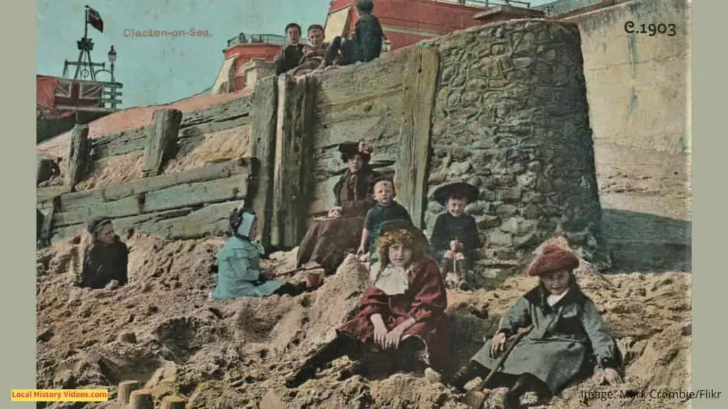 Old photo postcard of children on the beach at Clacton-on-Sea, Essex, circa 1903