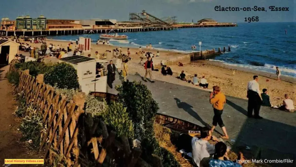 Old photo postcard of the beach, pier and rollercoaster at Clacton-on-Sea, circa 1968