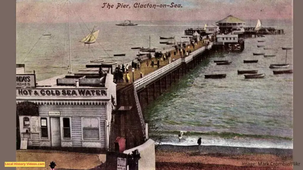 Old photo postcard of the length of the pier at Clacton-on-Sea, Essex