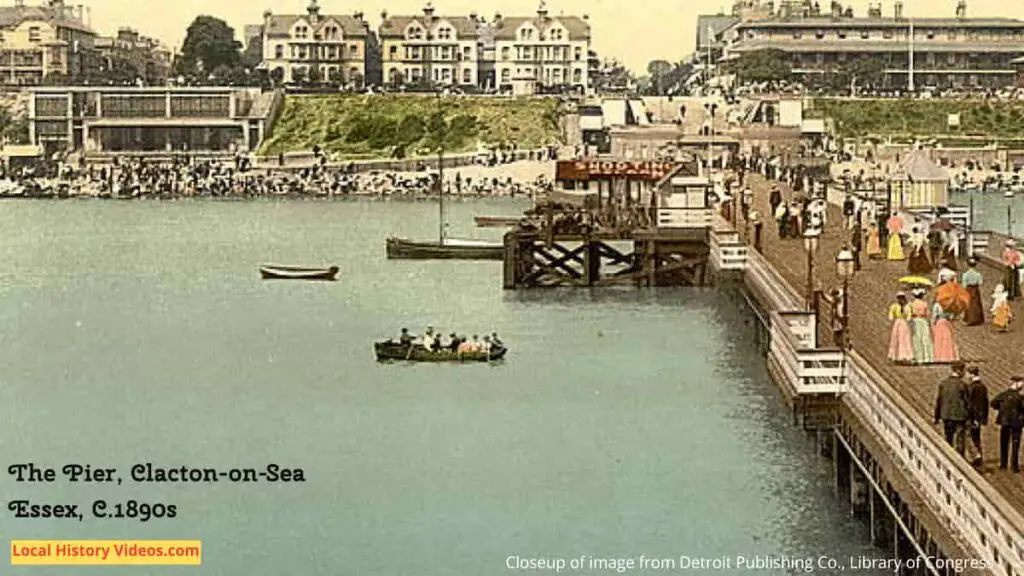 People boating in a closeup of an old photo postcard of the end of the pier at Clacton-on-Sea, Essex, in the 1890s