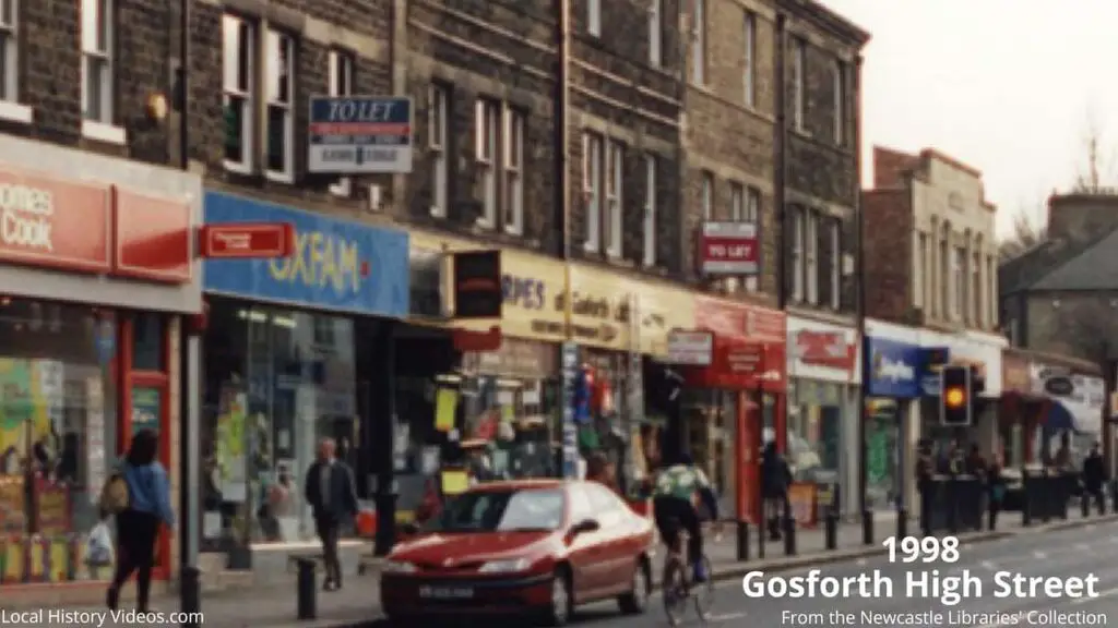 Closeup of a 1998 photo of Thomas Cook, Oxfam, and Thorpes, Gosforth High Street