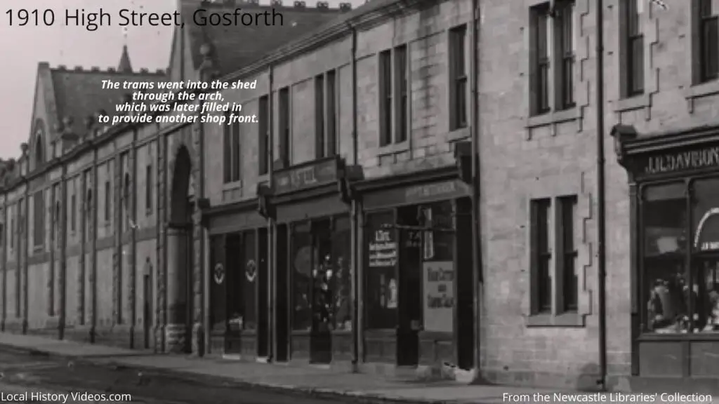 Old photo closeup of Davison's Chemist, Gosforth High Street, Gosforth, Newcastle upon Tyne, in 1910, showing the nearby shops and tram shed entrance