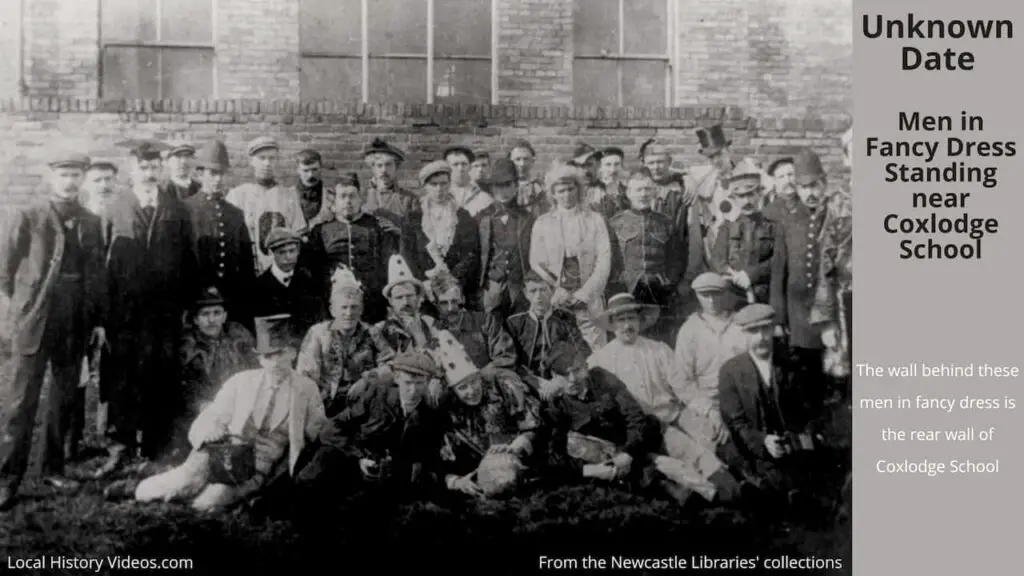 Old photo of men in fancy dress, standing near Coxlodge School, Newcastle upon Tyne