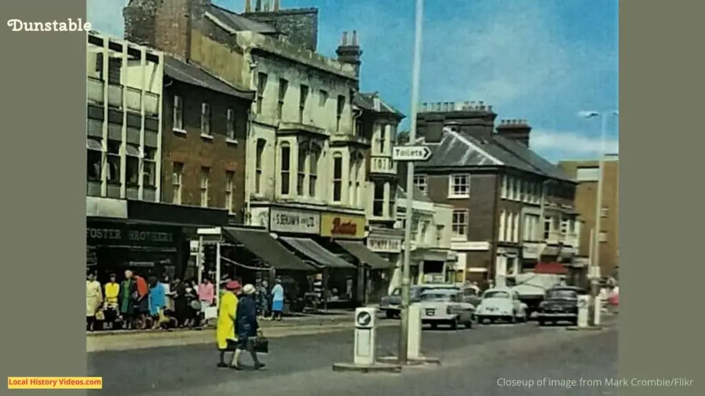 Closeup of an old photo postcard with local shops and pedestrians at Dunstable in the early 1970s